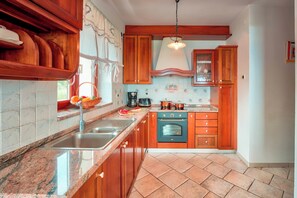 Family Villa, 4 Bedrooms, Mountainside (Pool Villa Abbazia Seaview) | Private kitchen | Fridge, oven, stovetop, dishwasher