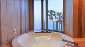 Luxury Suite | Bathroom | Jetted bath, rainfall showerhead, designer toiletries, hair dryer