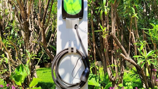 A charging station for electric vehicles surrounded by lush greenery. - Flat with terrace, quiet and sunny,2 bike, air cond,bike storage (Riva del Garda)