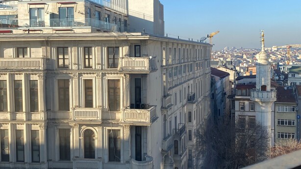 A multi-story building with classical architecture, featuring balconies and large windows. - Li Hotel Pera (Istanbul)