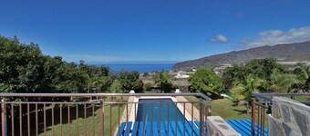 Semi-detached holiday home with pool and sea views