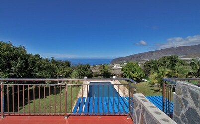 Semi-detached holiday home with pool and sea views