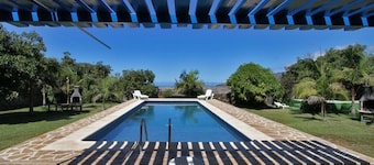 Semi-detached holiday home with pool and sea views