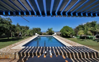 Semi-detached holiday home with pool and sea views