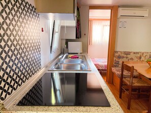 Fridge, microwave, stovetop, cookware/dishes/utensils