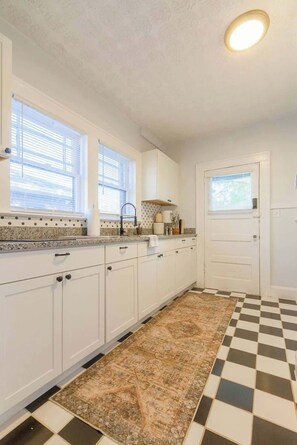 Fridge, microwave, coffee/tea maker, cookware/dishes/utensils