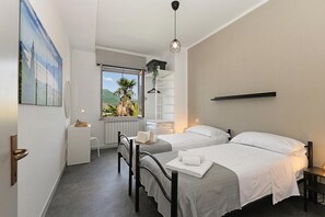 Family Apartment, Multiple Bedrooms (Appartamento Fabio Few Min From Lake) | 2 bedrooms, free WiFi, bed sheets