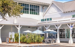 A restaurant named "Pizza by the Sea" with outdoor seating and umbrellas. - Watercolor - Resort Style Pools & Bikes Included (Santa Rosa Beach)