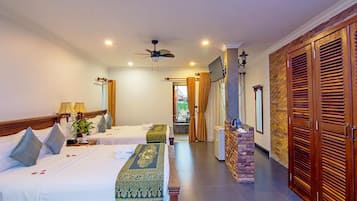 Deluxe Family Room, City View | Minibar, in-room safe, desk, laptop workspace