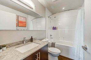 Bathtub, hair dryer, towels