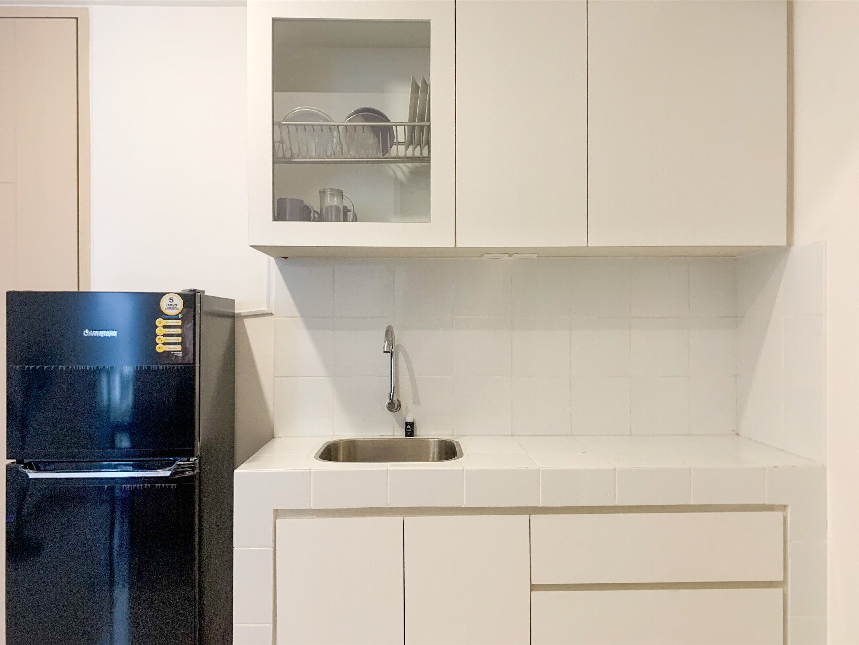 Apartamento, 2 quartos | Cozinha privada | Geladeira, cooktop, talheres/pratos/utensílios de cozinha