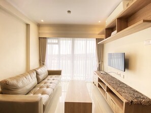 Apartment, 1 Bedroom | Living room | TV - Comfort Designed 1BR Apartment at Gateway Pasteur (Cimahi)