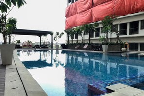 Outdoor pool - Modern Look Studio Room at LRT City Jatibening Apartment (Bekasi)