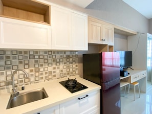 Studio | Private kitchen | Fridge, stovetop, cookware/dishes/utensils - Restful And Functional Studio Apartment At Springlake Summarecon Bekasi (Bekasi)