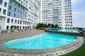 Outdoor pool - Comfort 1Br At Patraland Urbano Apartment (Bekasi)