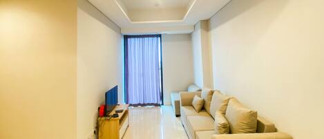 Apartment, 2 Bedrooms | Living room | TV