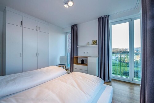 Top Apartment in Strandnähe mit Loggia, Strandkorb, zwei Bädern & Sauna im Haus!