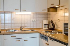 Fridge, microwave, stovetop, coffee/tea maker