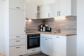 Réfrigérateur, four, plaque de cuisson, lave-vaisselle