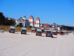 On the beach, sun-loungers