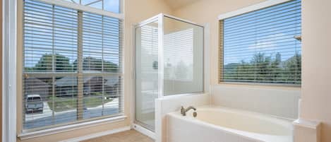 Bathtub, towels, soap, shampoo