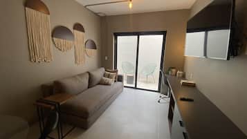 Comfort Apartment, Patio | Living area | 50-inch Smart TV with digital channels, TV