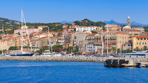 A coastal town with historic buildings, a marina, and a mountain backdrop. - New accommodation, summer kitchen, terrace, garden (Olmeto)