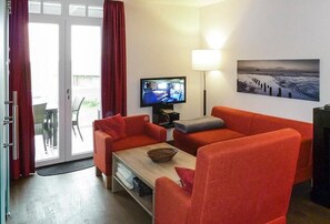 Télévision, cheminée, console de jeux vidéo, chaîne hi-fi
