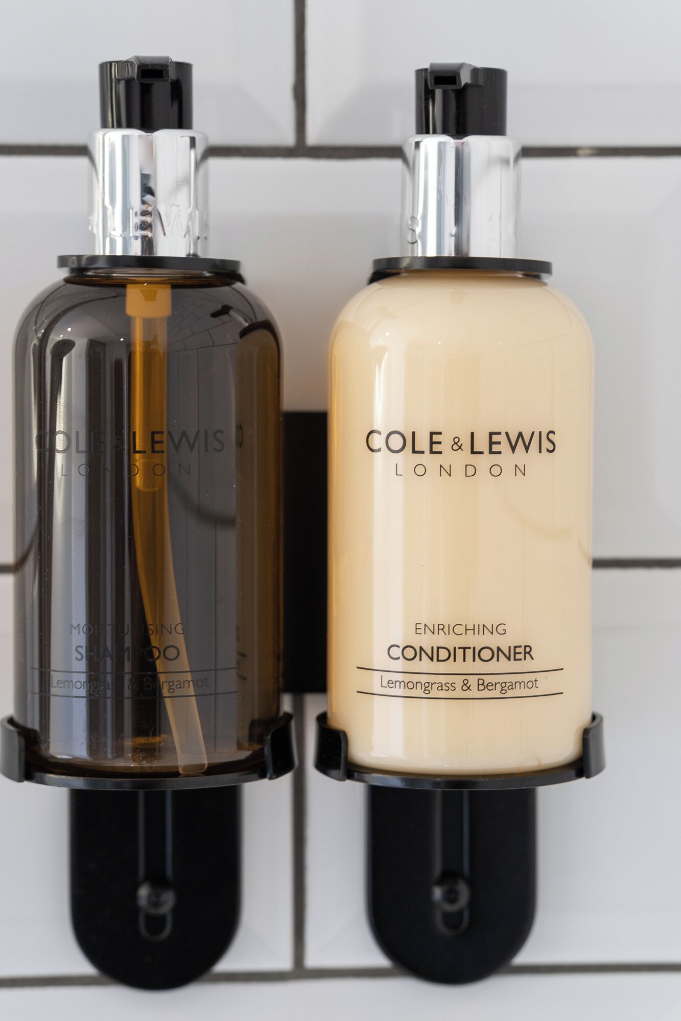 Two bottles of Cole & Lewis London conditioner and moisturizing shampoo.