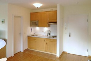 Fridge, microwave, stovetop, coffee/tea maker