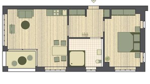 A floor plan of a hotel room with a kitchenette, a seating area, a small bathroom, and a large bed.