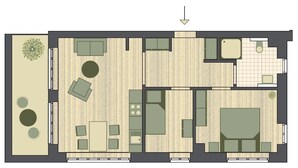 Plano de planta de un hotel que incluye un comedor, varias habitaciones, un baño y un pequeño jardín.