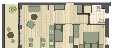 A floor plan of a hotel with a dining area, multiple bedrooms, a bathroom, and a small garden.