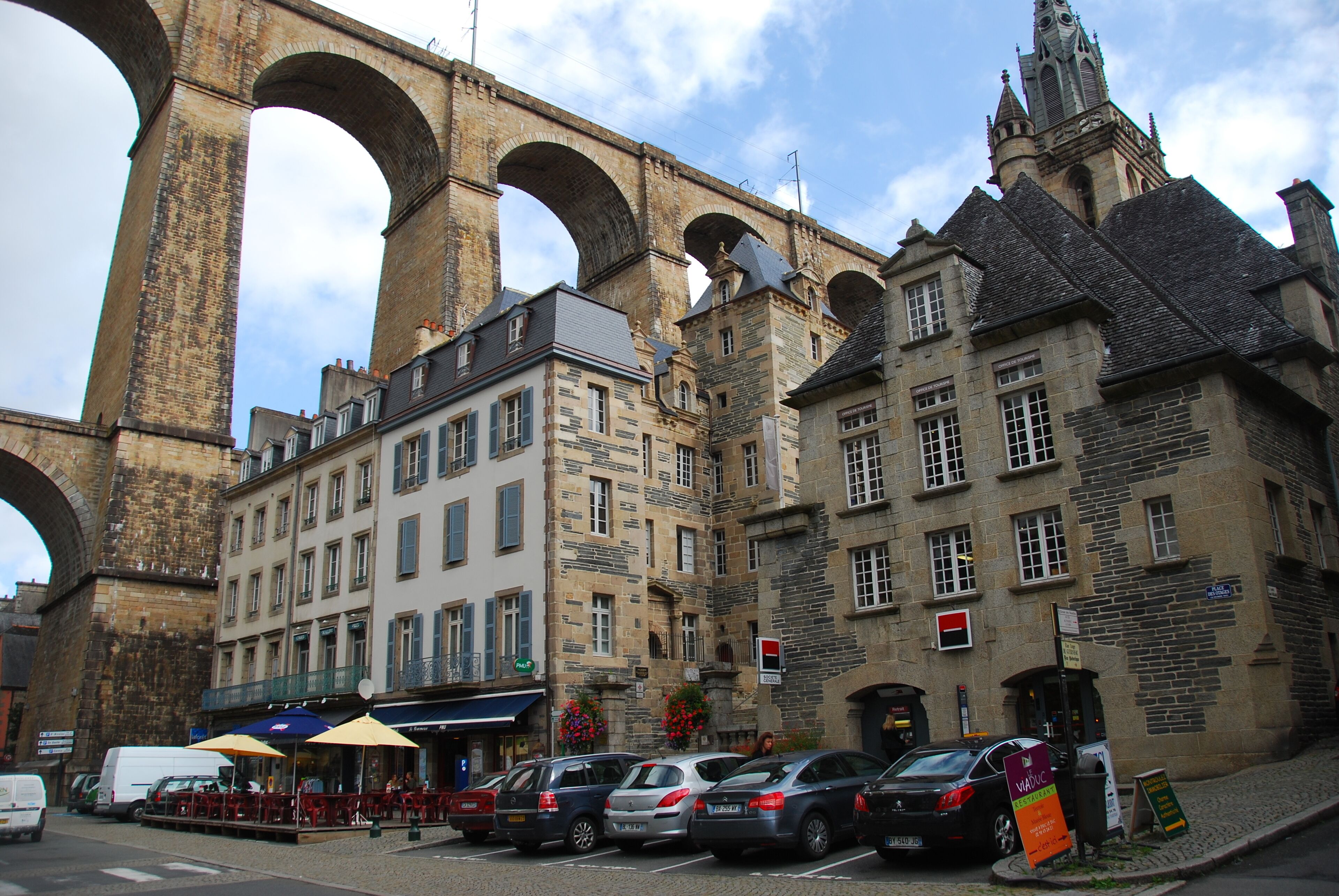 A historic building with multiple arches and a clock tower.