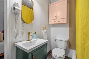 Bathtub, hair dryer, towels