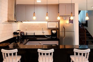Presidential Apartment | Private kitchen | Fridge, microwave, cookware/dishes/utensils, cleaning supplies