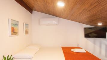 Apartamento família | Ferros/tábuas de passar roupa, Wi-Fi de cortesia, roupa de cama