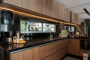 Deluxe Apartment, 2 Bedrooms, 2 Bathrooms, Ground Floor | Private kitchen | Fridge, microwave, cookware/dishes/utensils, cleaning supplies
