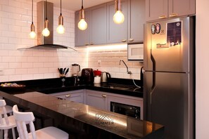 Apartment | Private kitchen | Fridge, microwave, cookware/dishes/utensils, cleaning supplies