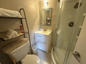 Shower, hair dryer, towels, soap
