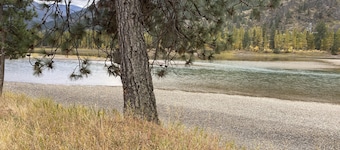 Stunning 9.3 acres riverfront w electric- near Quinn’s Hotsprings!