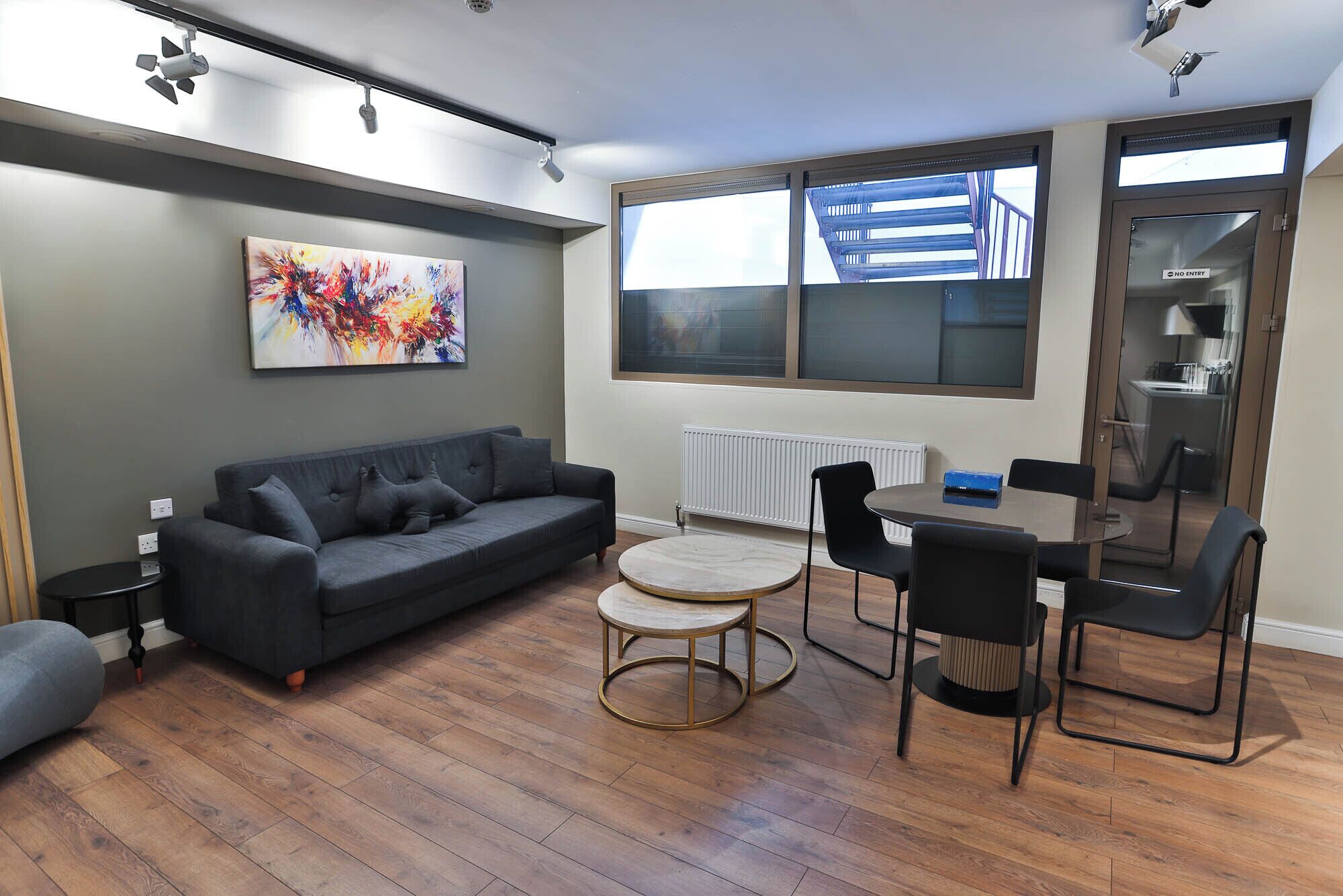 Luxury Quadruple Room | Living area | 50-inch Smart TV with cable channels, TV