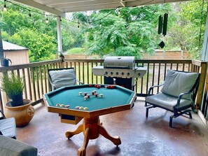 A pool table with billiard balls, a barbecue grill, and outdoor seating. - Secluded Half Acre Gem w/ Private Pickleball Court (Austin)