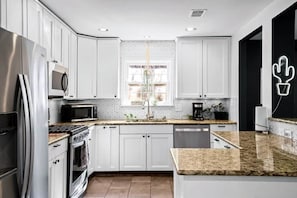 Fridge, stovetop, dining tables
