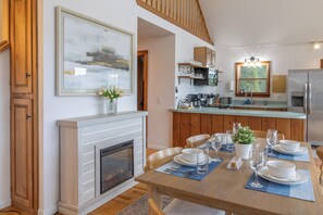 Oven, stovetop, electric kettle, dining tables