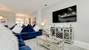 Smart TV, fireplace, books, computer monitors