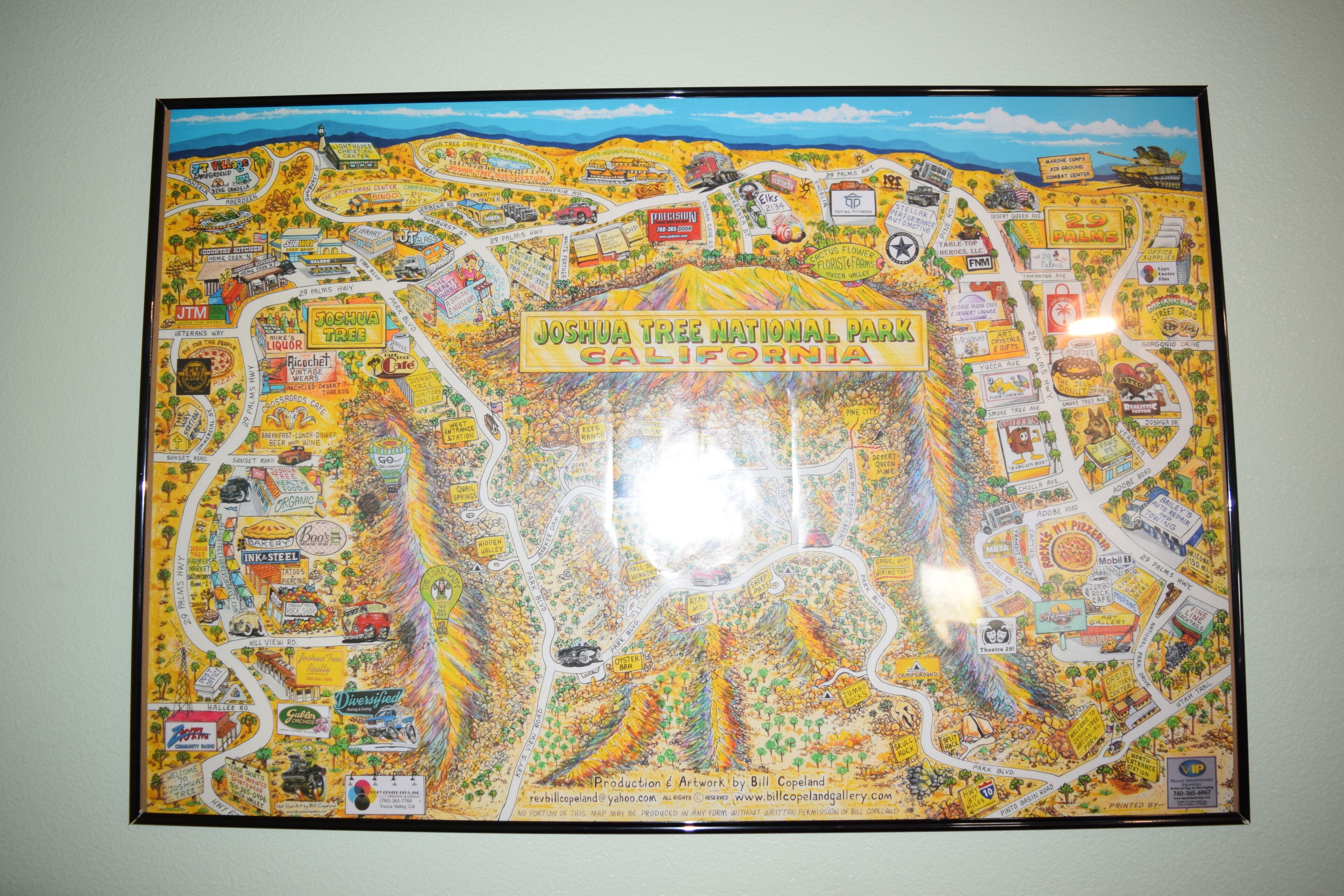 A colorful map of Joshua Tree National Park, California, highlighting various attractions and amenities.