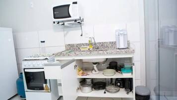 Microwave, blender, cookware/dishes/utensils