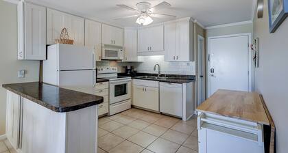 Relaxing ocean-view condo with on-site pool, private balcony & central AC