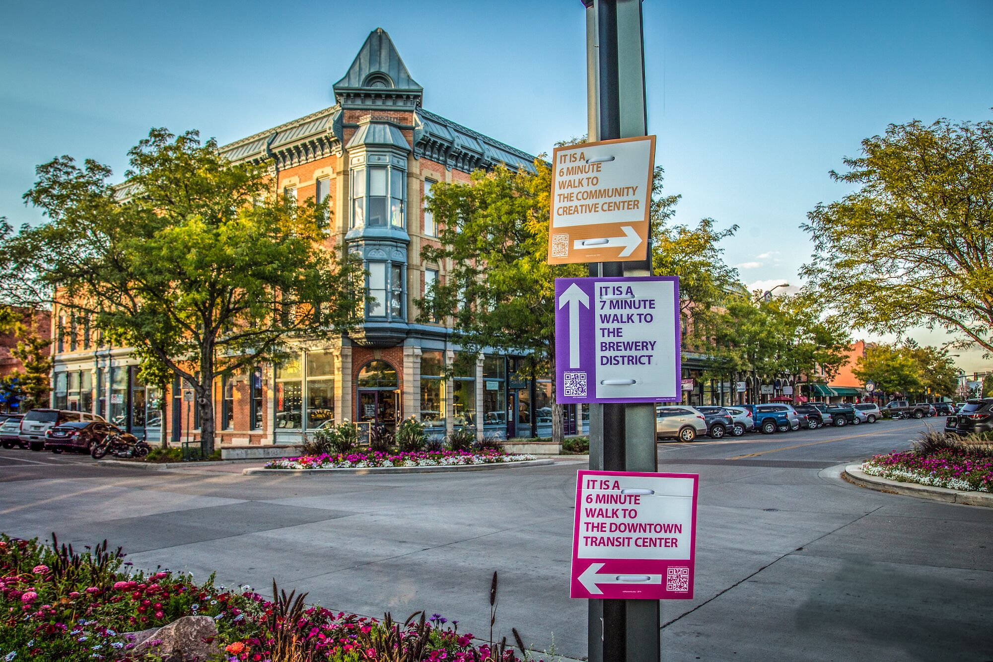Directional signs for the Community Creative Center, Brewery District, and Downtown Transit Center.